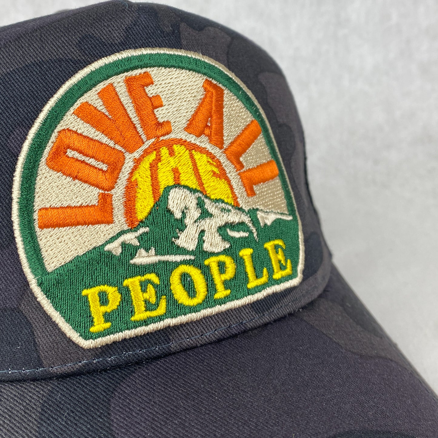 Love All The People retro embroidered patch trucker cap