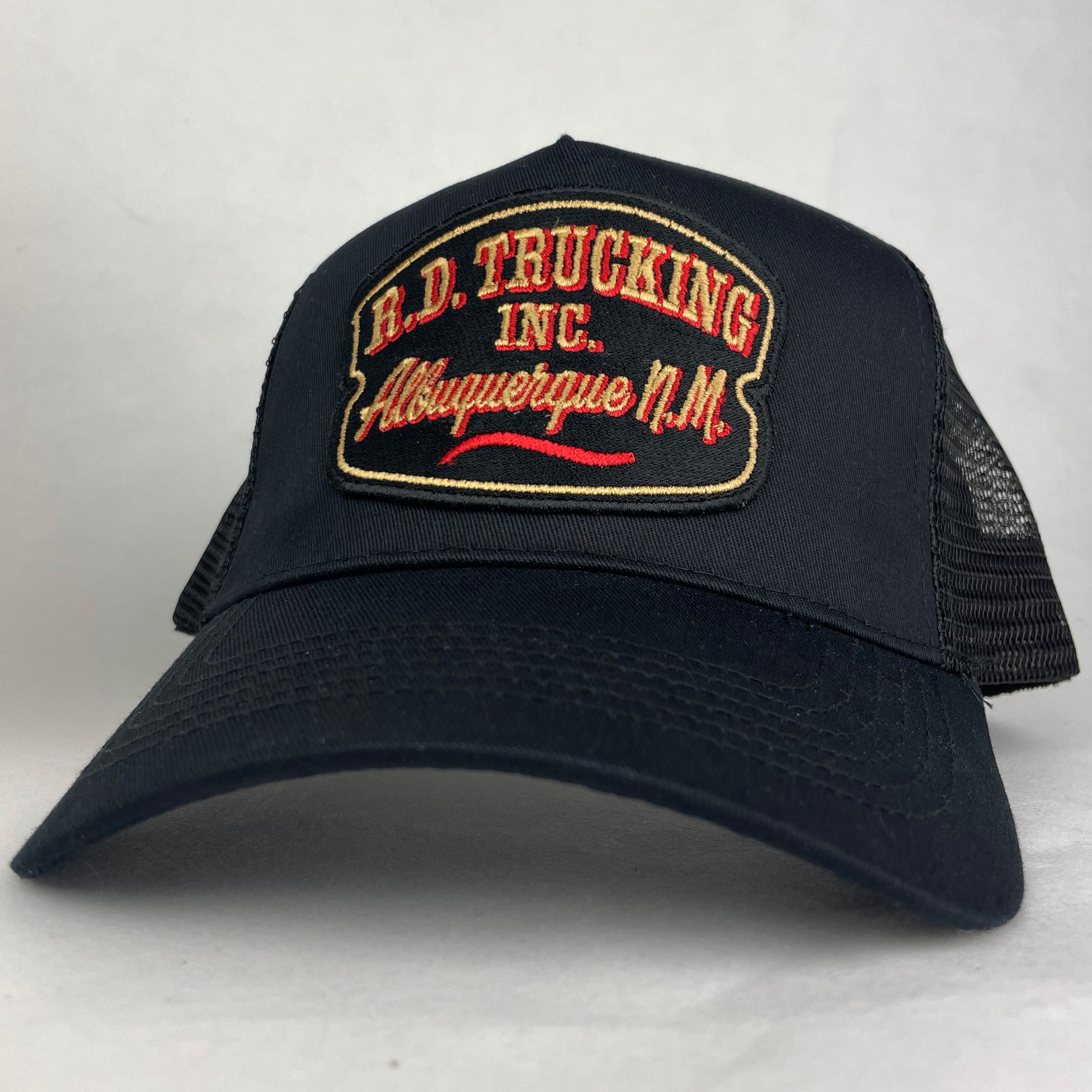 R.D. Trucking Inc embroidered trucker hat in black with vintage trucking company patch