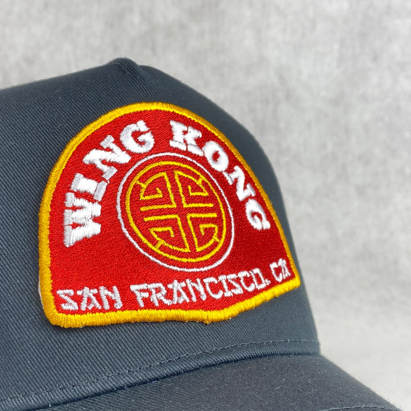 Wing Kong Trading embroidered retro trucker cap